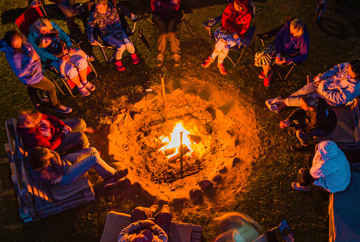 Kids around campfire