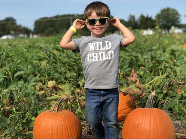 Child in Pumpkin Patch